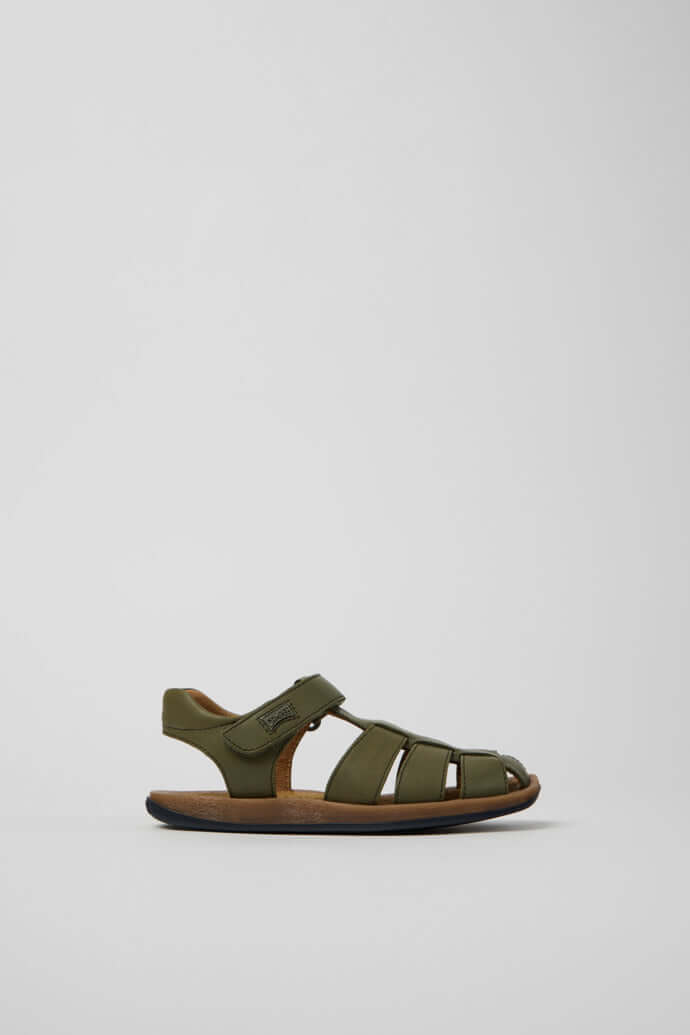 Green leather closed sandals for kids by Acorn & Pip, featuring adjustable hook-and-loop straps and ergonomic design.