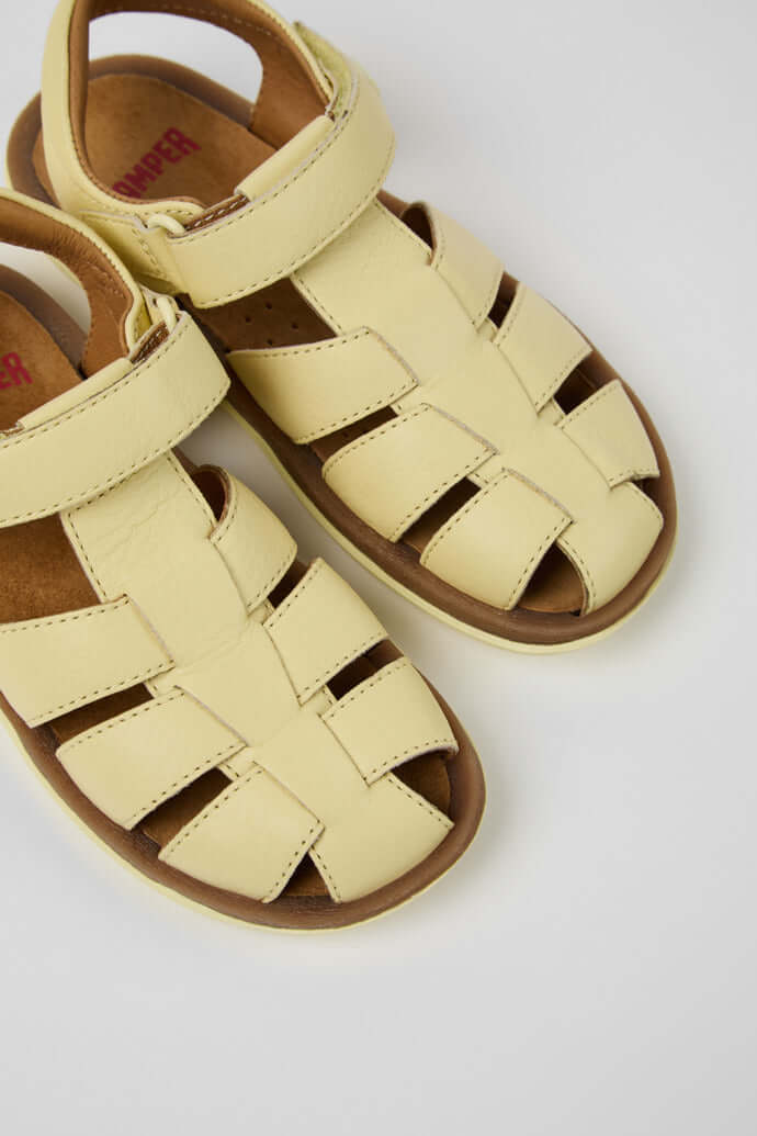 Yellow leather closed sandals for kids by Camper: Bicho, featuring adjustable design and rubber outsoles.