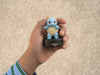 Hand holding Pokémon Squirtle Tonie character